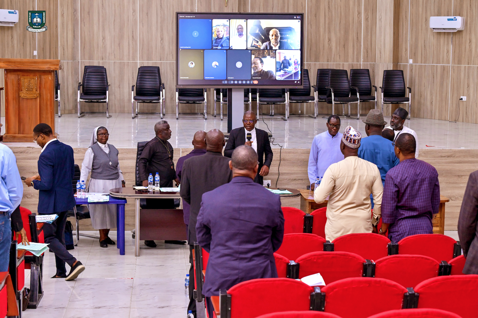 Rev. Fr. Prof. Hyacinth Ichoku, Vice-Chancellor of Veritas University Abuja, signing the Humanitas AI Compact